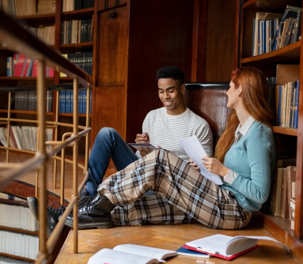 Two university students studying at library