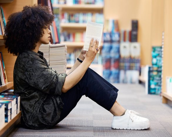 University, library book and girl student learning, reading and studying by school bookshelf for kn