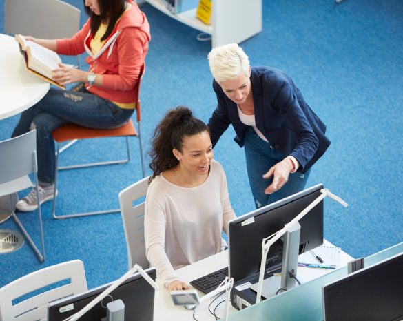 University students working in library