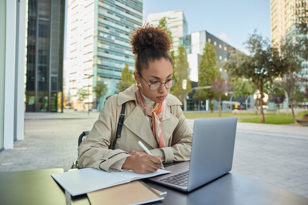 Busy student prepares for university admission watches training webinar concentrated in laptop scree