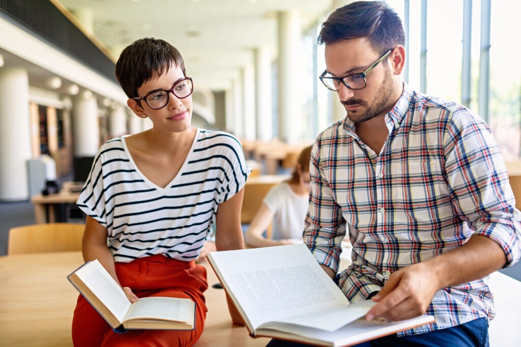 Education friendship people concept. Group of happy students learning together in college library