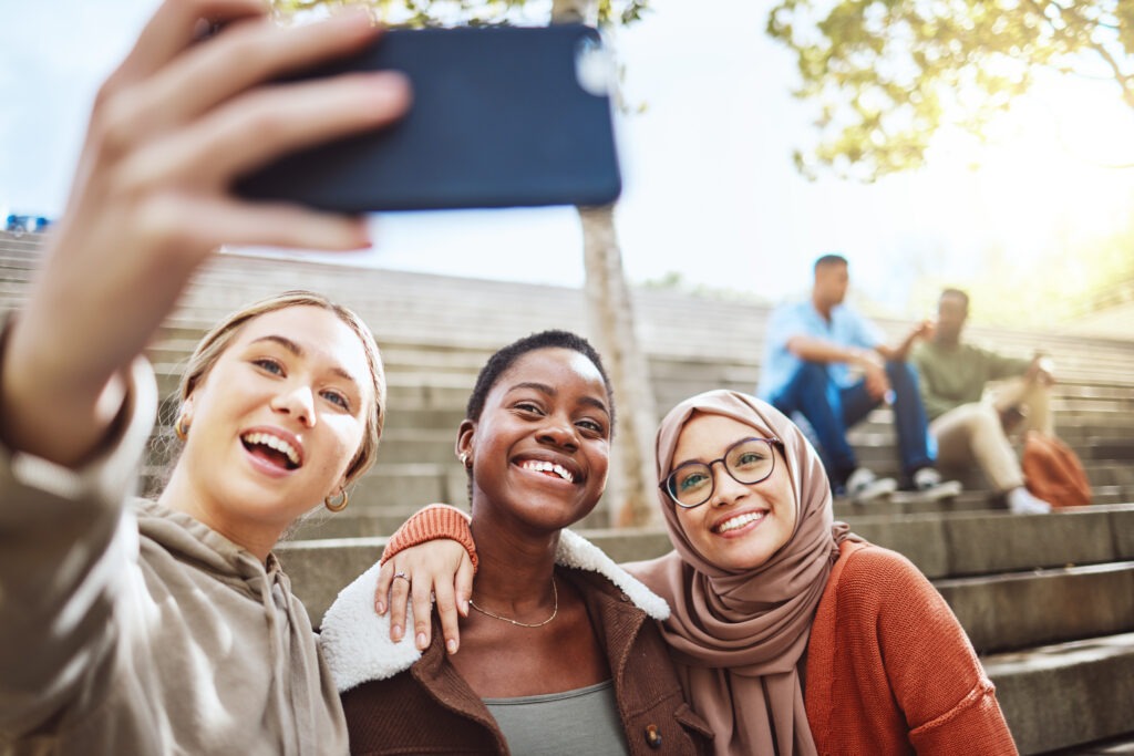 Students, diversity or phone selfie on college campus bleachers, university stairs of school steps