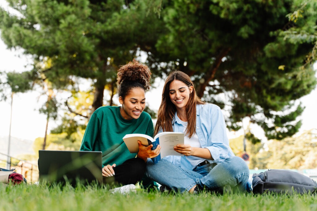 University friends studying together at university campus