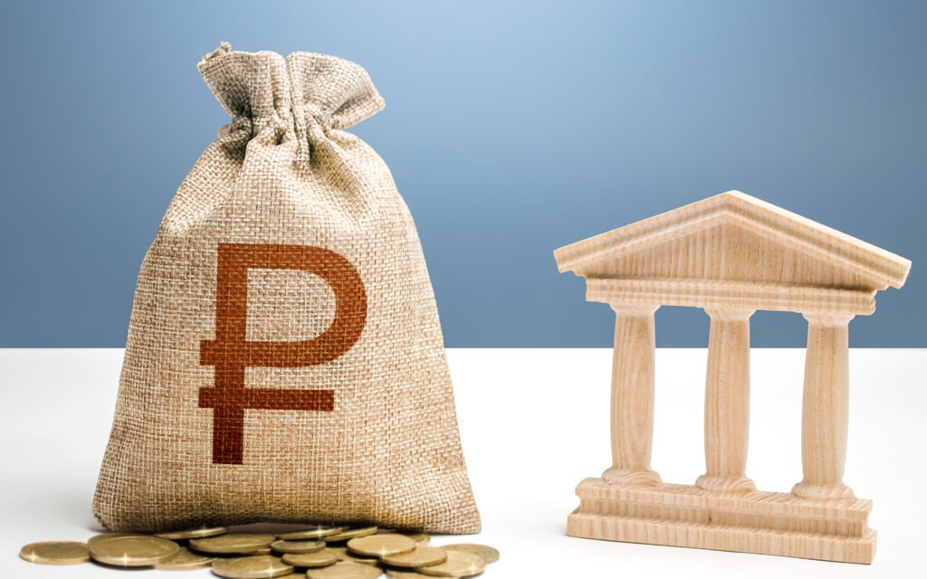 Russian ruble money bag and bank / government building. Budgeting, national financial system.