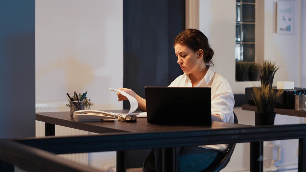 Office worker analyzing financial data and app extension