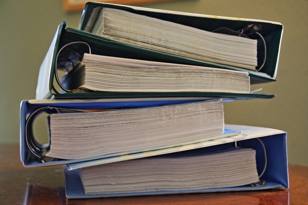 Pile of document ring binders