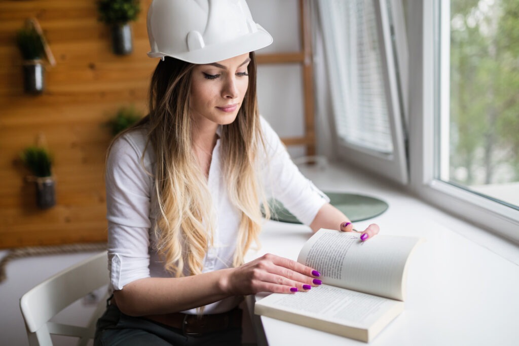 Beautiful woman reading and studying for university exams