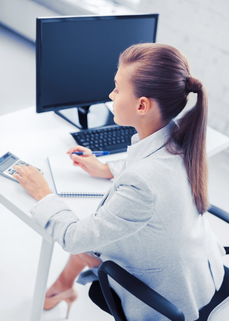 businesswoman with notebook and calculator