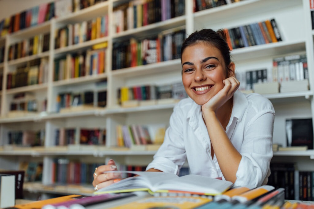 Happy girl using her literature.