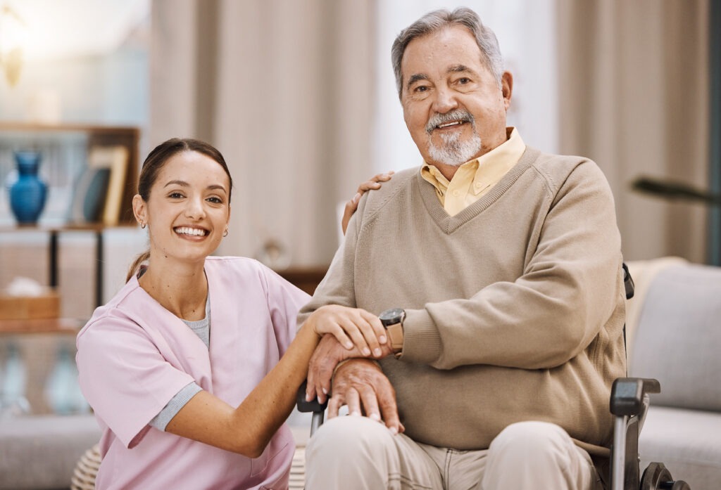 Healthcare, disability and man in wheelchair with nurse in retirement or nursing home with smile on