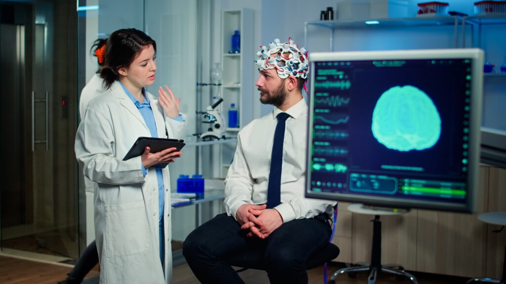 Specialist doctor in neuroscience taking notes on clipboard