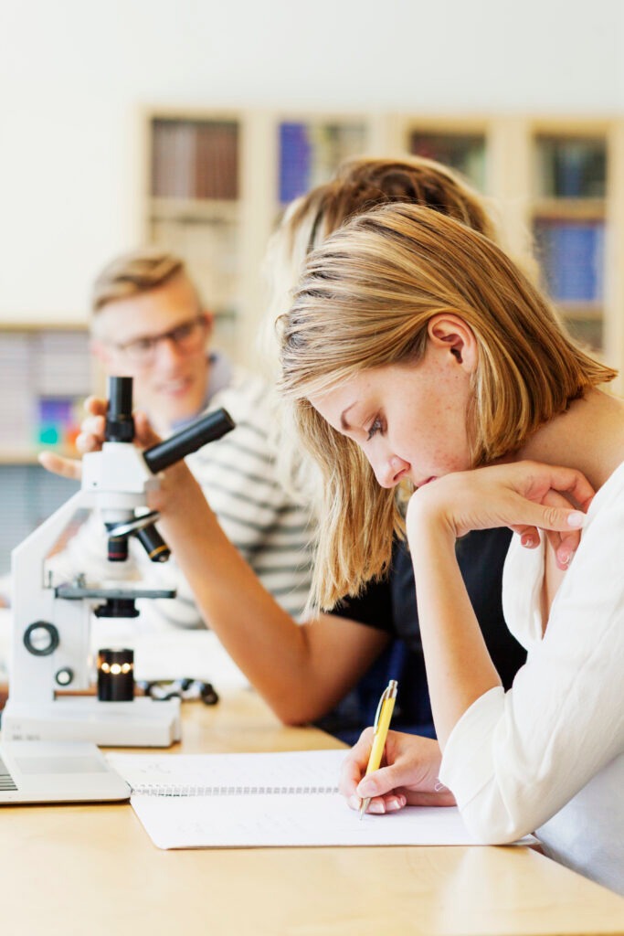 Young students sitting in science classroom