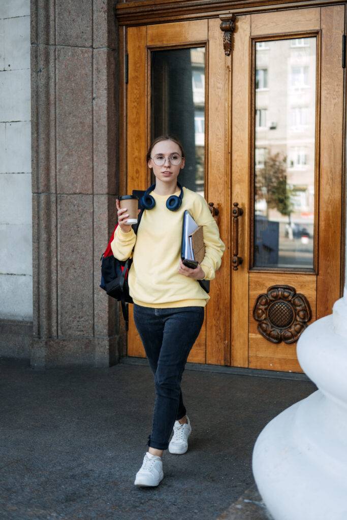 Student loan, Student finance for undergraduates. Outdoor portrait of student girl