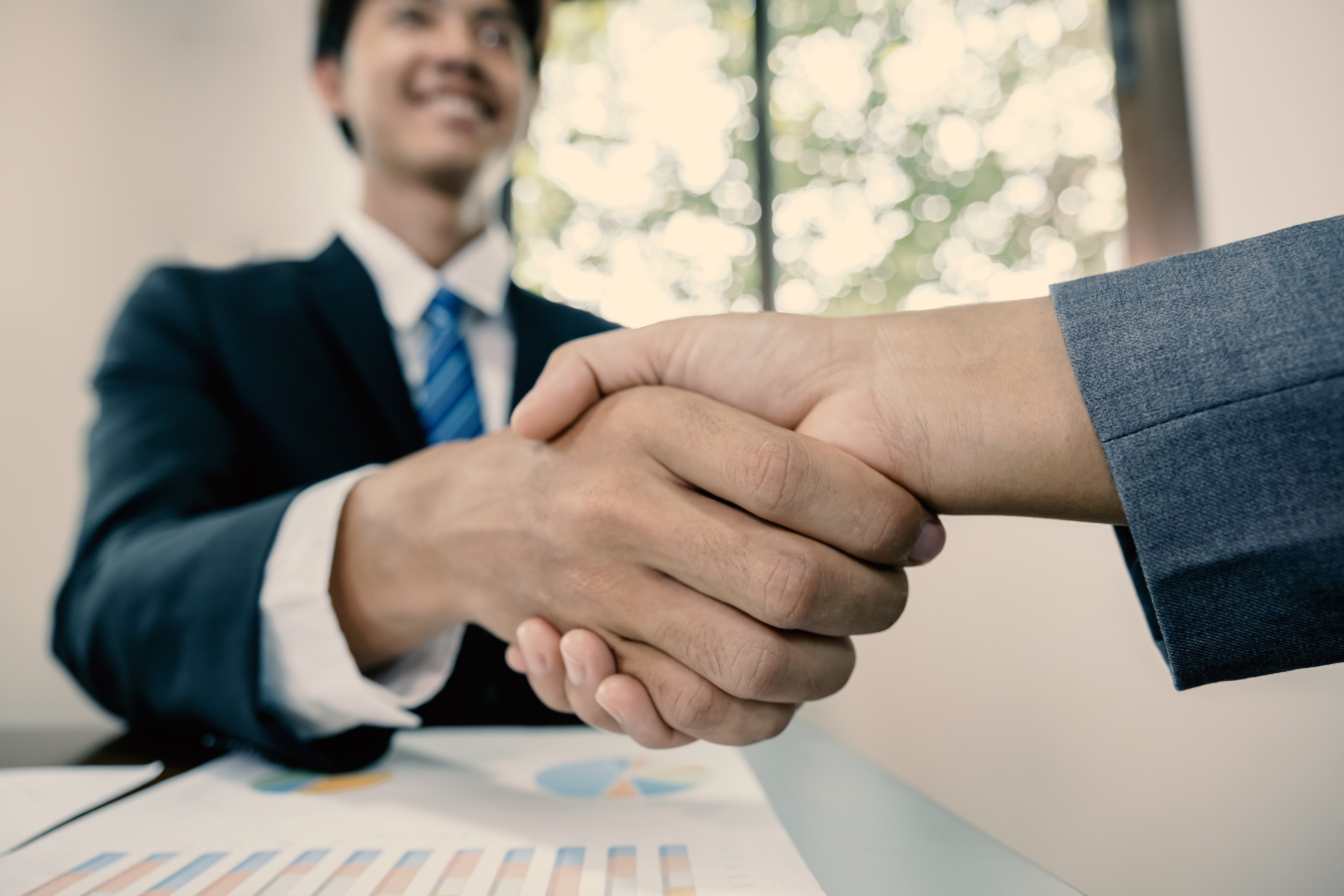 hands shake after business office executives are interviewing job applicants in the meeting room