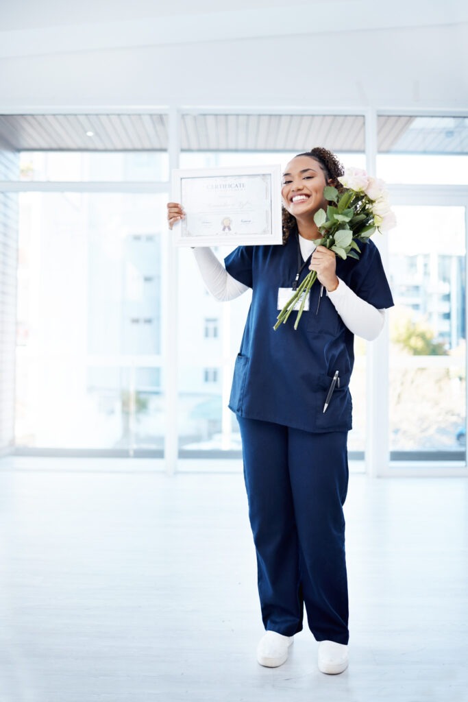 Nursing, celebration and black woman graduate with smile, flowers and ADN certificate at hospital.