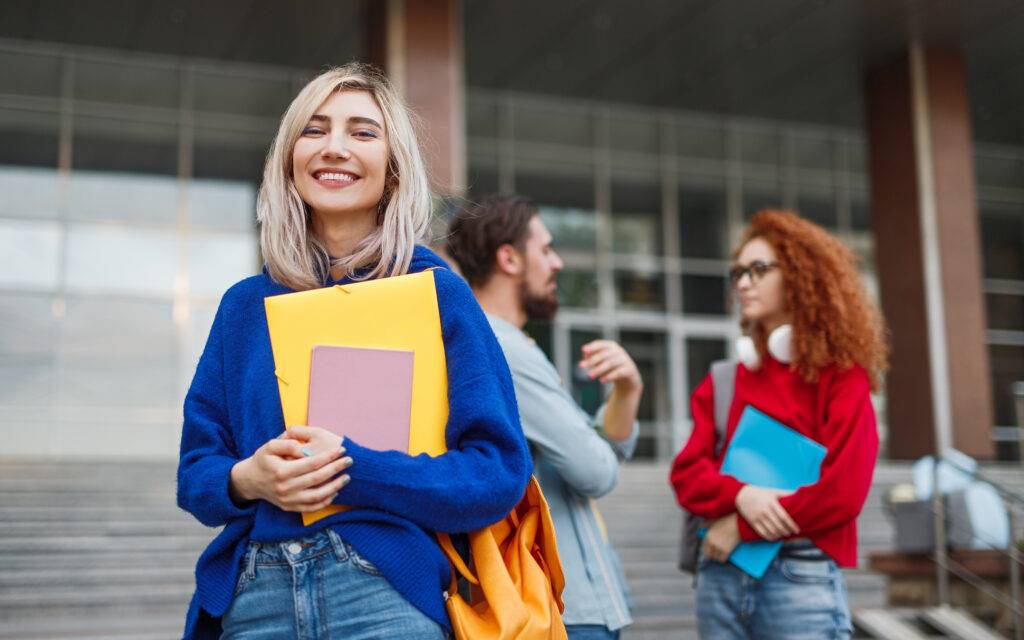 Cheerful young woman applying to university